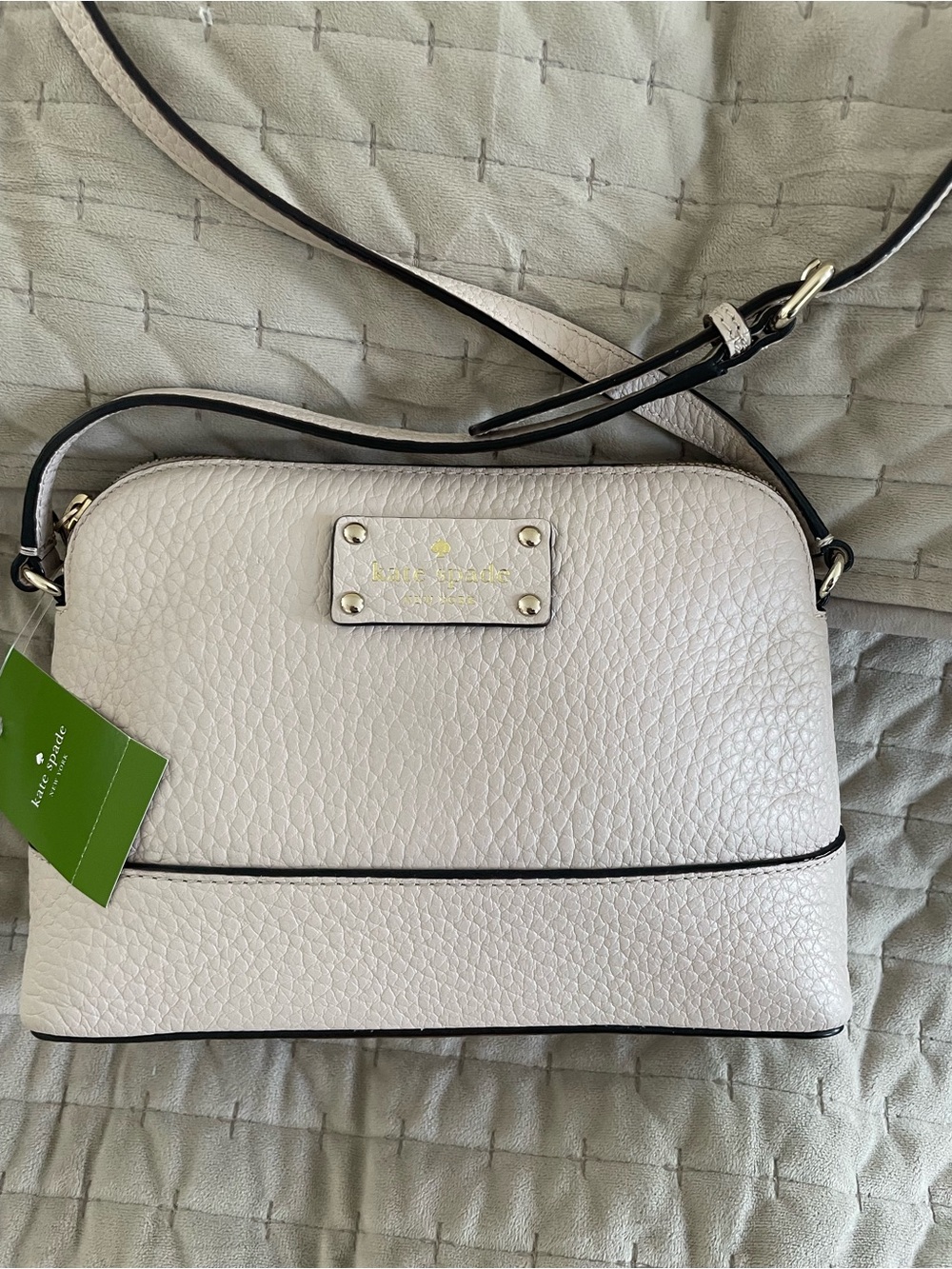kate spade pumice pebbled leather shoulder bag with black trim and gold hardware